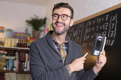 Man holding an antiquated VHS tape symbolizing how old media has drawbacks that business and corporate transcription services can overcome.