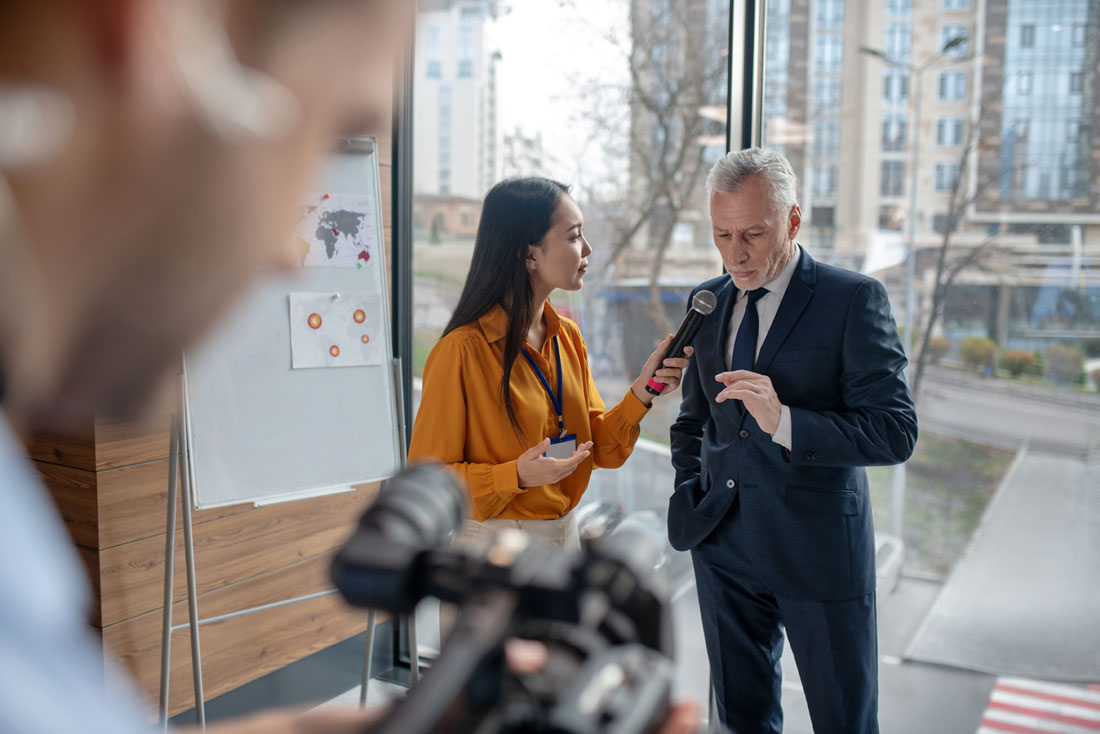 Researcher interviewing an expert. Interview transcription helps academics and researchers by converting hours of audio and video into useable text.