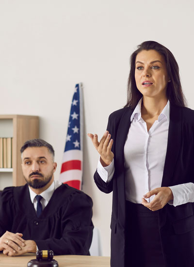 Woman at a legal hearing making a recorded statement. Preferred Transcriptions provides legal dictation to convert audio files to written documents.